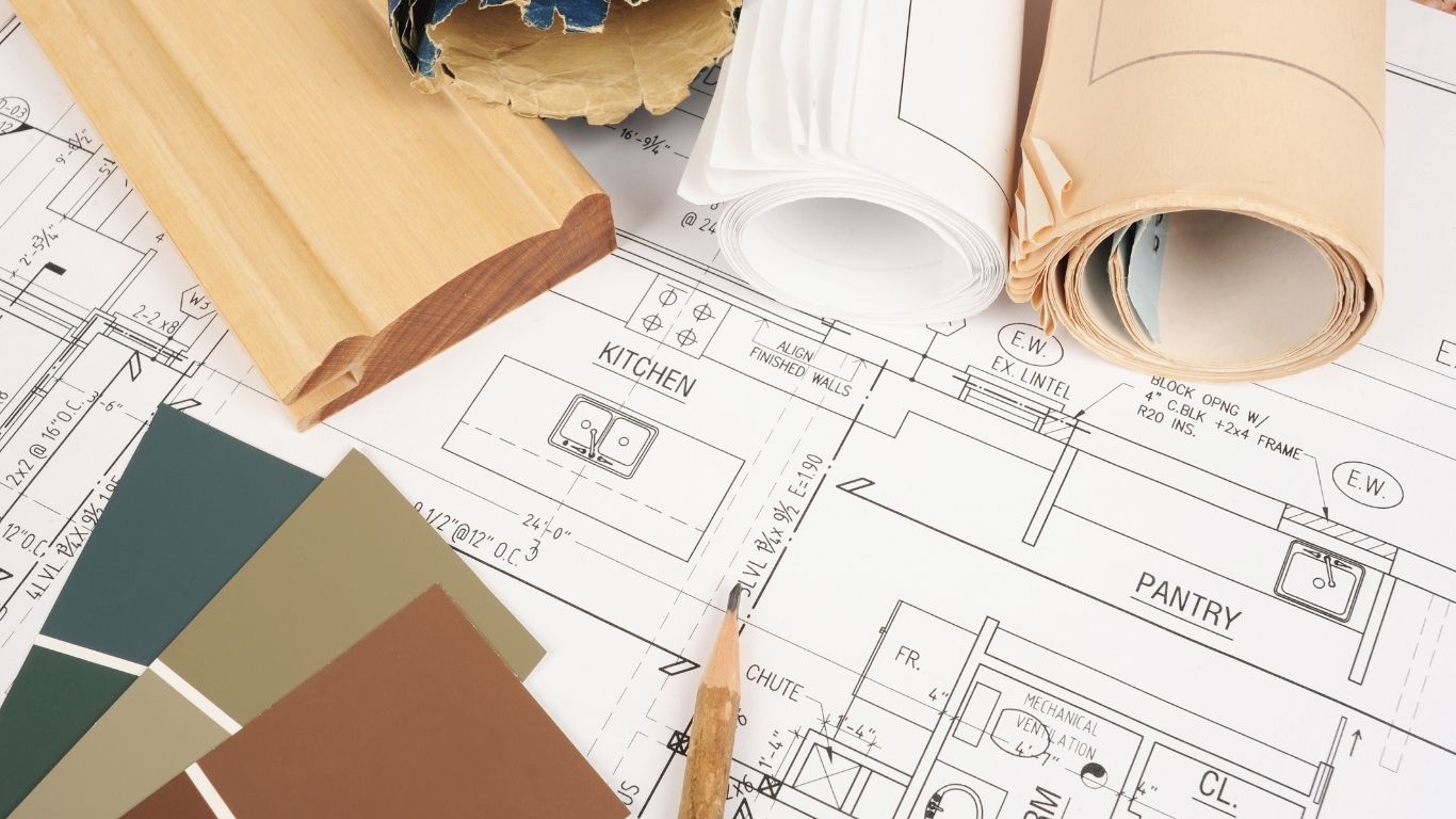 図面や材料を見ながら、DIYか依頼か、費用や仕上がりを考えるイメージ